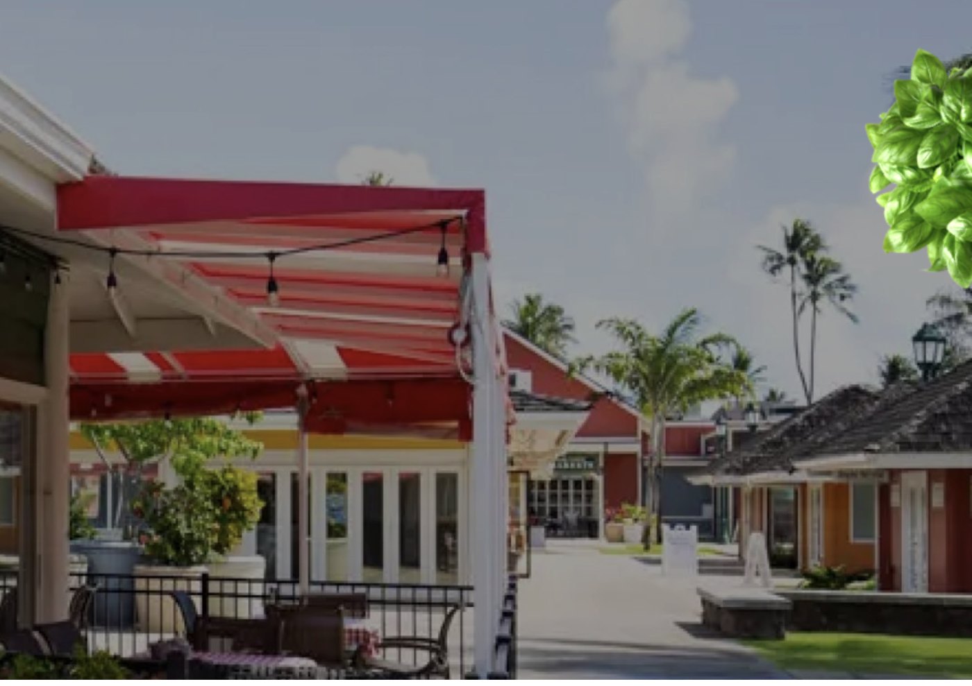 The red-striped awning and patio at Bobby V's, Coconut Marketplace